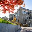 A student walks towards Bernstein Hall 