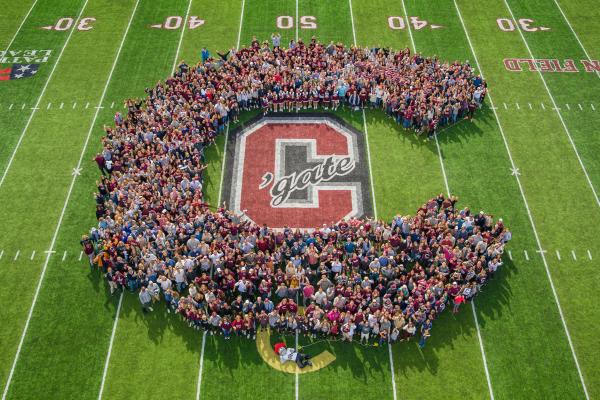 Students form the shape of a 'C' at Andy Kerr Field