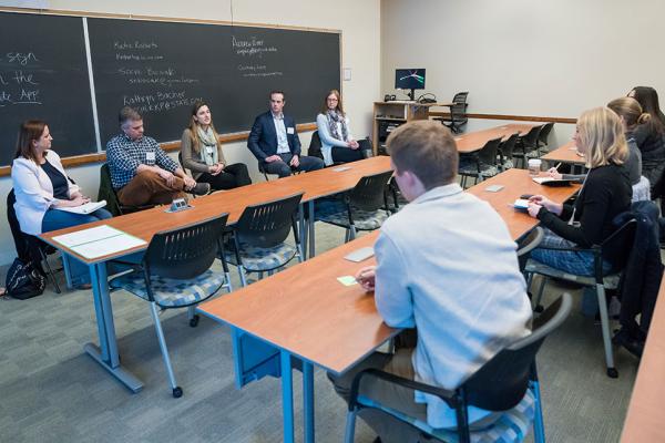Students interacting with a panel of alumni at Sophomore Connections