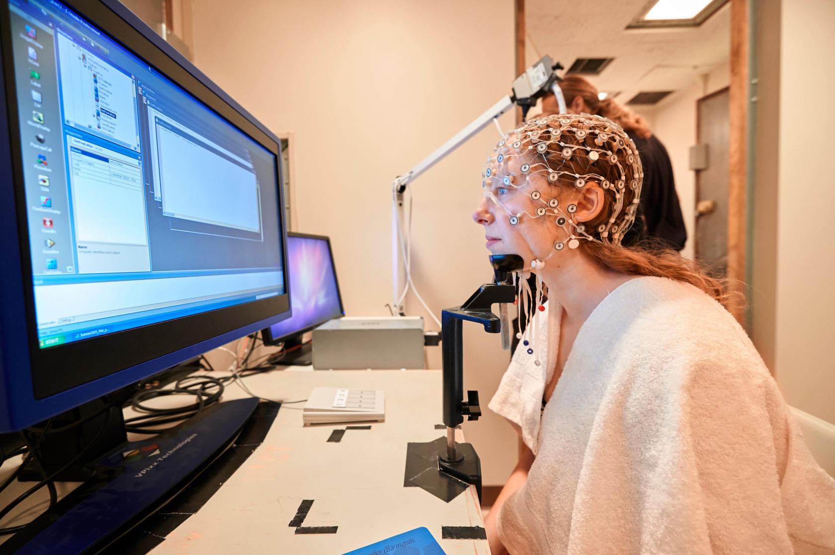 Student using brain imaging machine as part of a psychology class