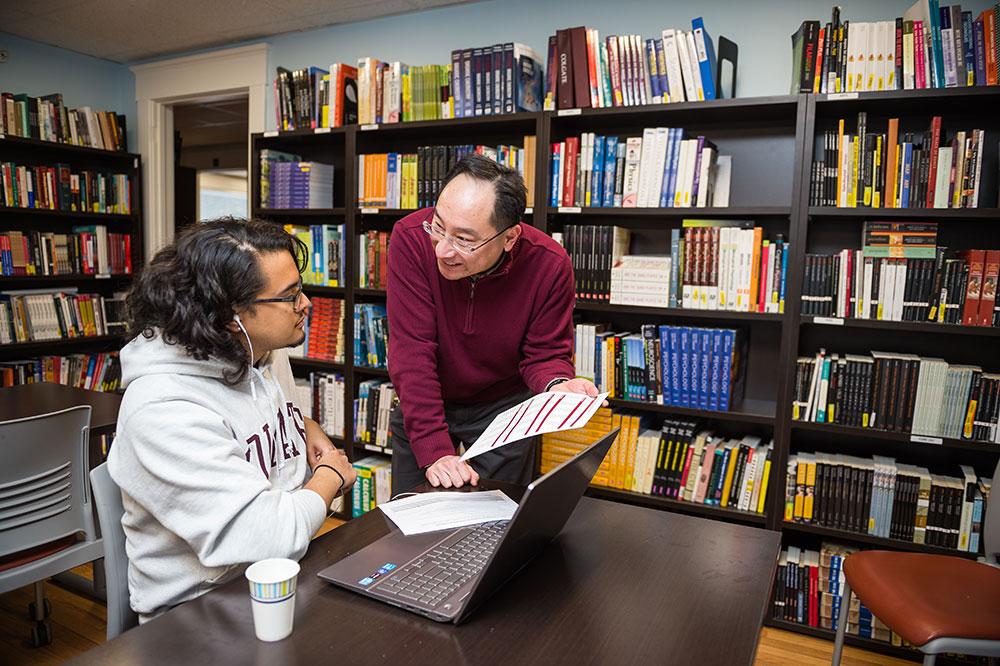 Student interacting with professor