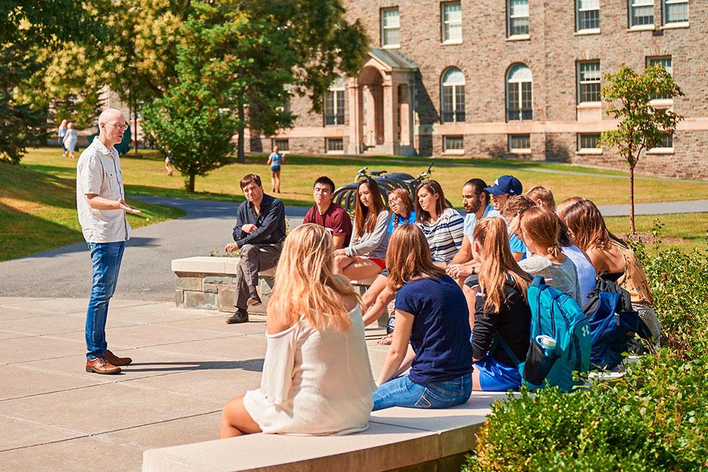 Professor addressing an outdoor classroom